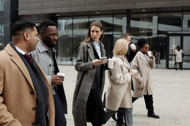 Professionals networking and talking at a career event